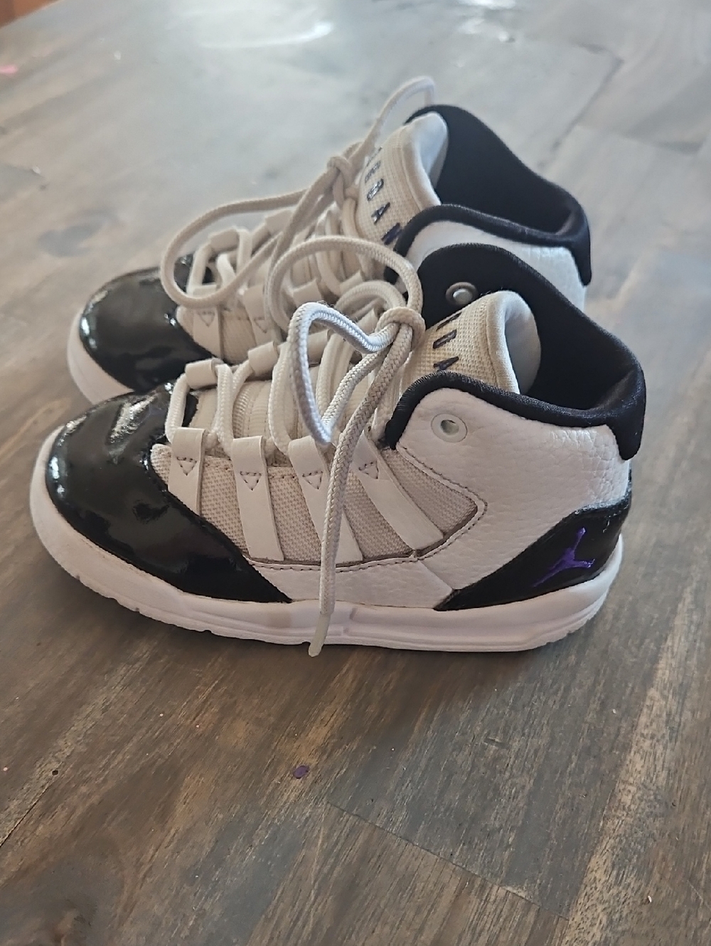 Jordan Kids White and Black High-Top Sneakers with Purple Detail